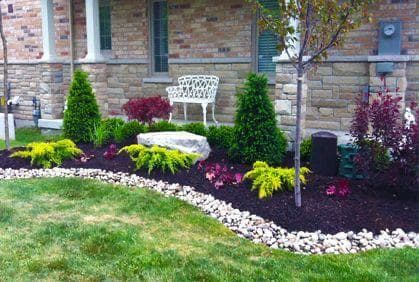 picture of a beautifulgarden in front of a porch in the front of a home in seattle washington